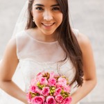 Happy Hispanic bride outdoors