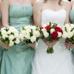 Close Up Of Bride And Bridesmaids Holding Flowers