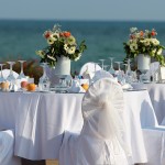 Outdoor Table Setting At Wedding Reception By The Sea